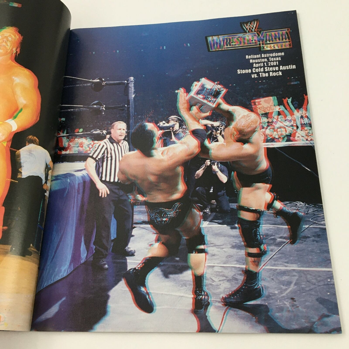 Image from WWE Present 2004 Wrestle Mania magazine depicting a dramatic wrestling moment in 3D, featuring iconic wrestlers in action.