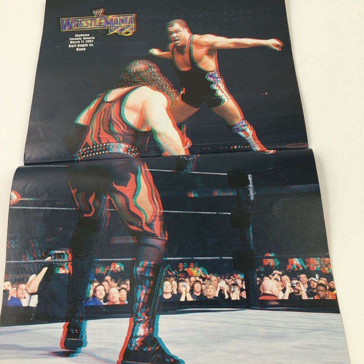 WWE Present 2004 Wrestle Mania image displaying a dynamic wrestling match featuring Kane leaping off the ropes, highlighting the excitement of the event.