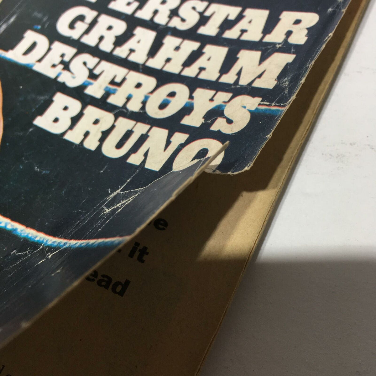 Image highlighting the torn corner of The Wrestler Magazine April 1976 cover, indicating its vintage condition.