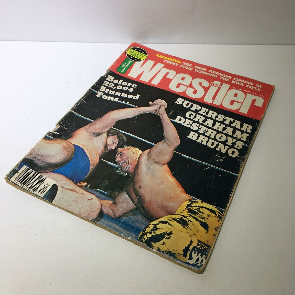 The Wrestler Magazine April 1976 featuring Superstar Graham Destroys Bruno on the cover, showcasing an iconic wrestling moment with two wrestlers in action. The magazine is in good condition, with slight wear on the edges, perfect for collectors.