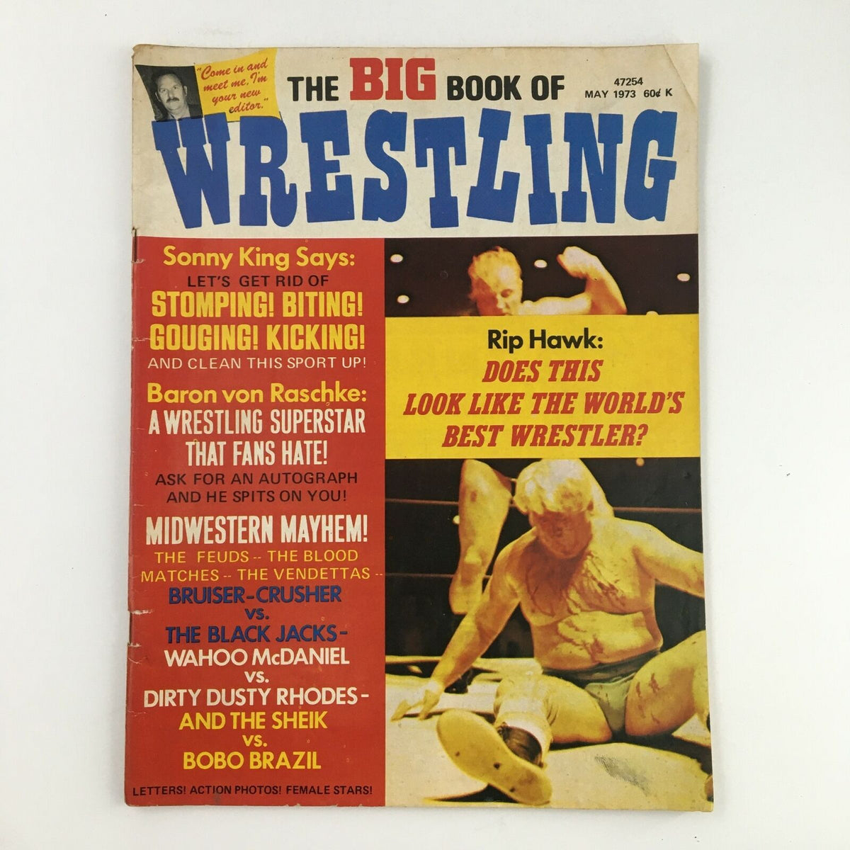 Cover image of The Big Book of Wrestling, May 1973, featuring wrestling legends Wahoo McDaniel and Dusty Rhodes, showcasing exciting promotional graphics and key match details.