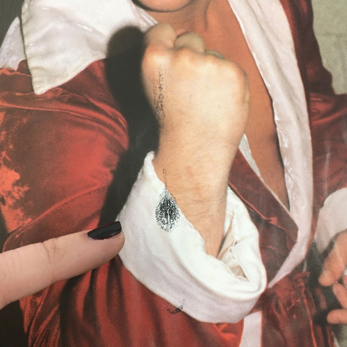 Detailed view of fingerprint smudge over an article about Tommy Rich in Wrestling's Main Event Magazine October 1982. Illustrates the magazine's vintage quality and history.