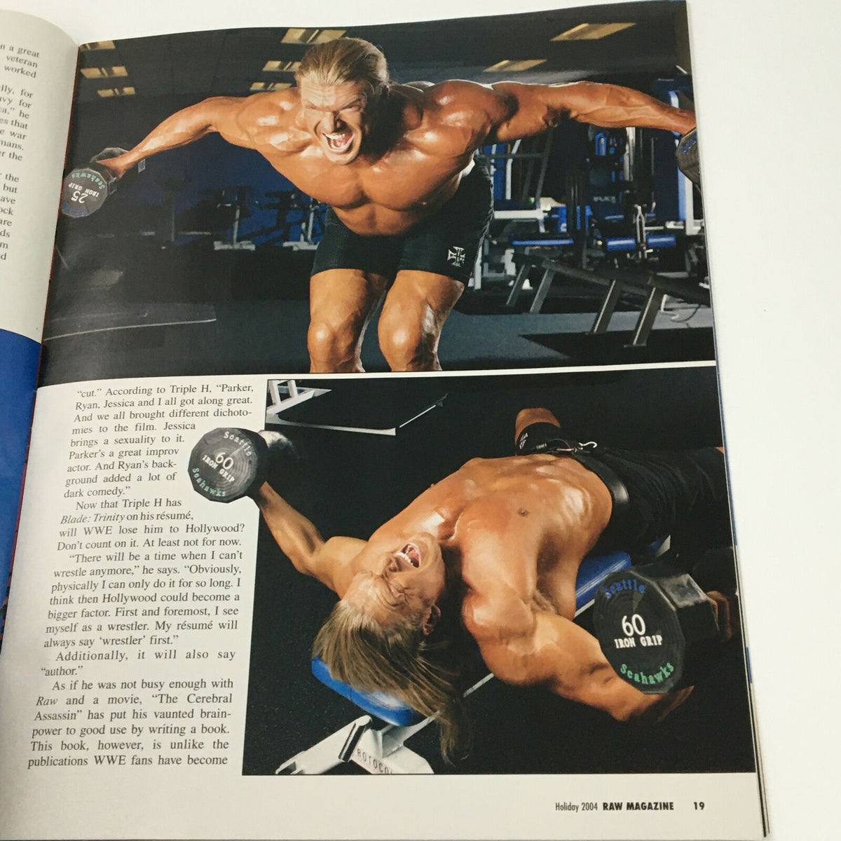 Image from WWE Raw Magazine Holiday 2004 showcasing a muscular wrestler performing a dumbbell exercise, illustrating fitness and training themes.