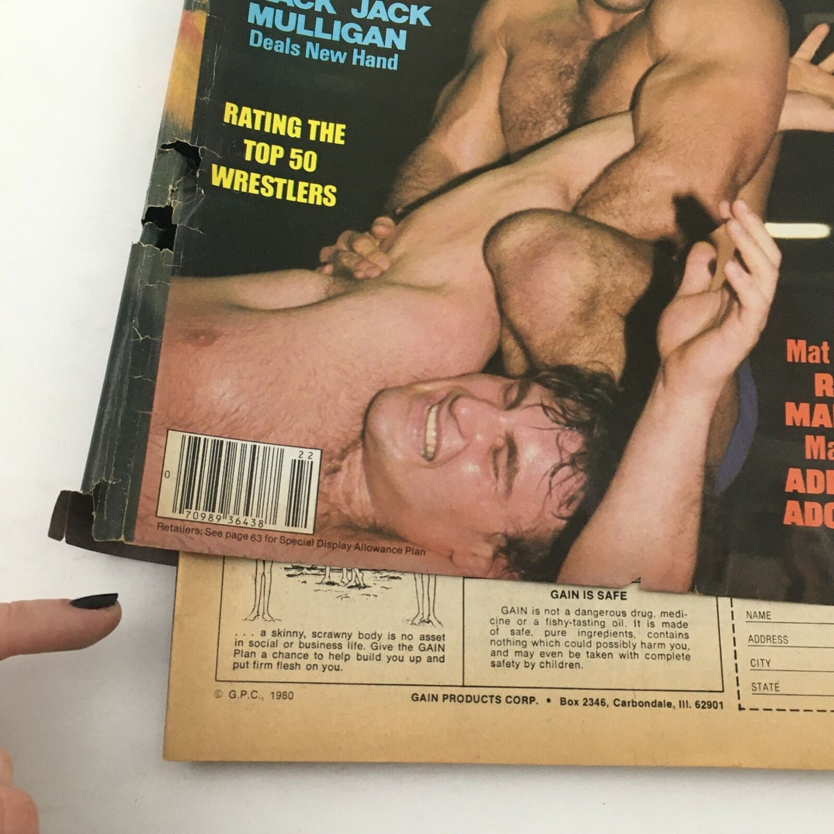 Back cover of Wrestling World Magazine Summer 1982 featuring wrestling action between Jack Mulligan and another wrestler, capturing the essence of wrestling competitions.