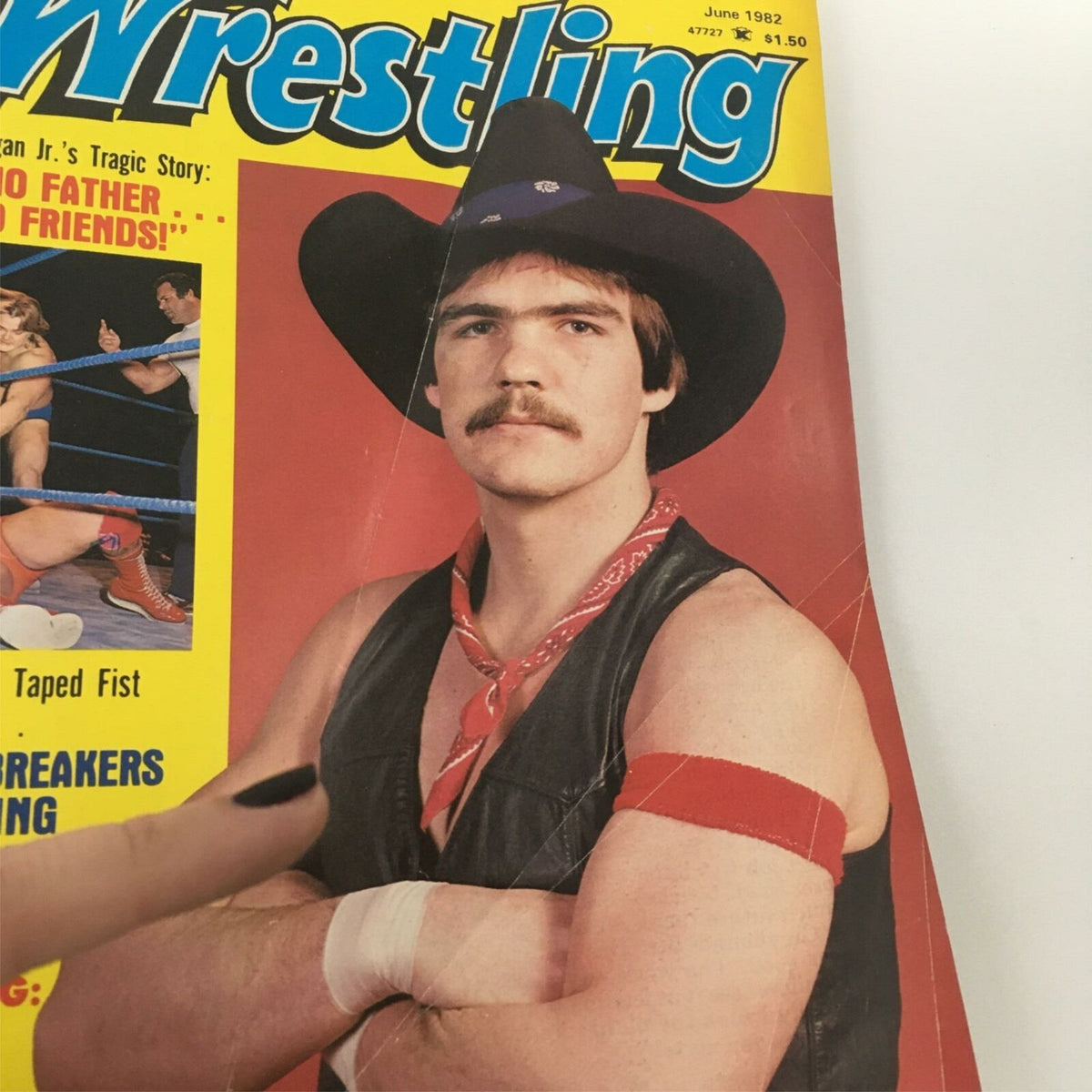 Front cover of Inside Wrestling Magazine June 1982, featuring a wrestler in cowboy attire, red scarf, and the magazine's title prominently displayed.