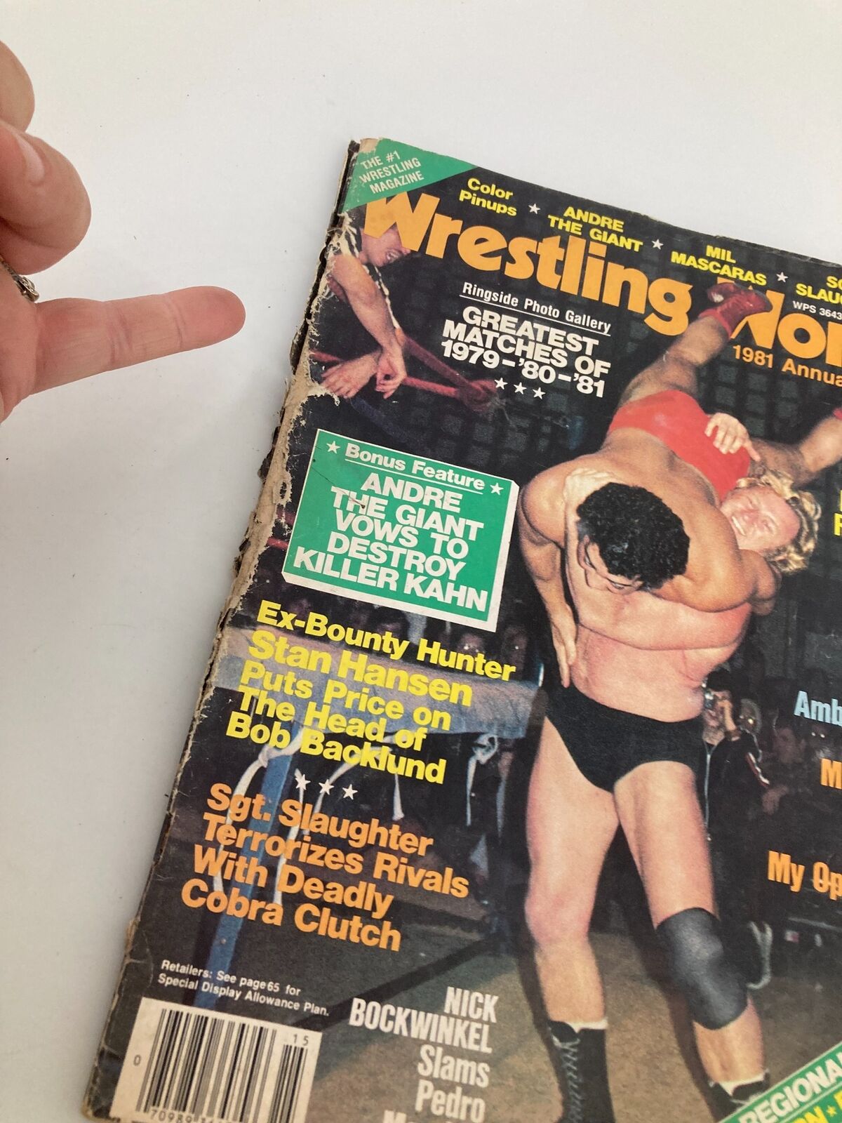 Close-up of Wrestling World Magazine 1981 cover with Andre The Giant vs Killer Kahn article, displaying the magazine's wear and tear.