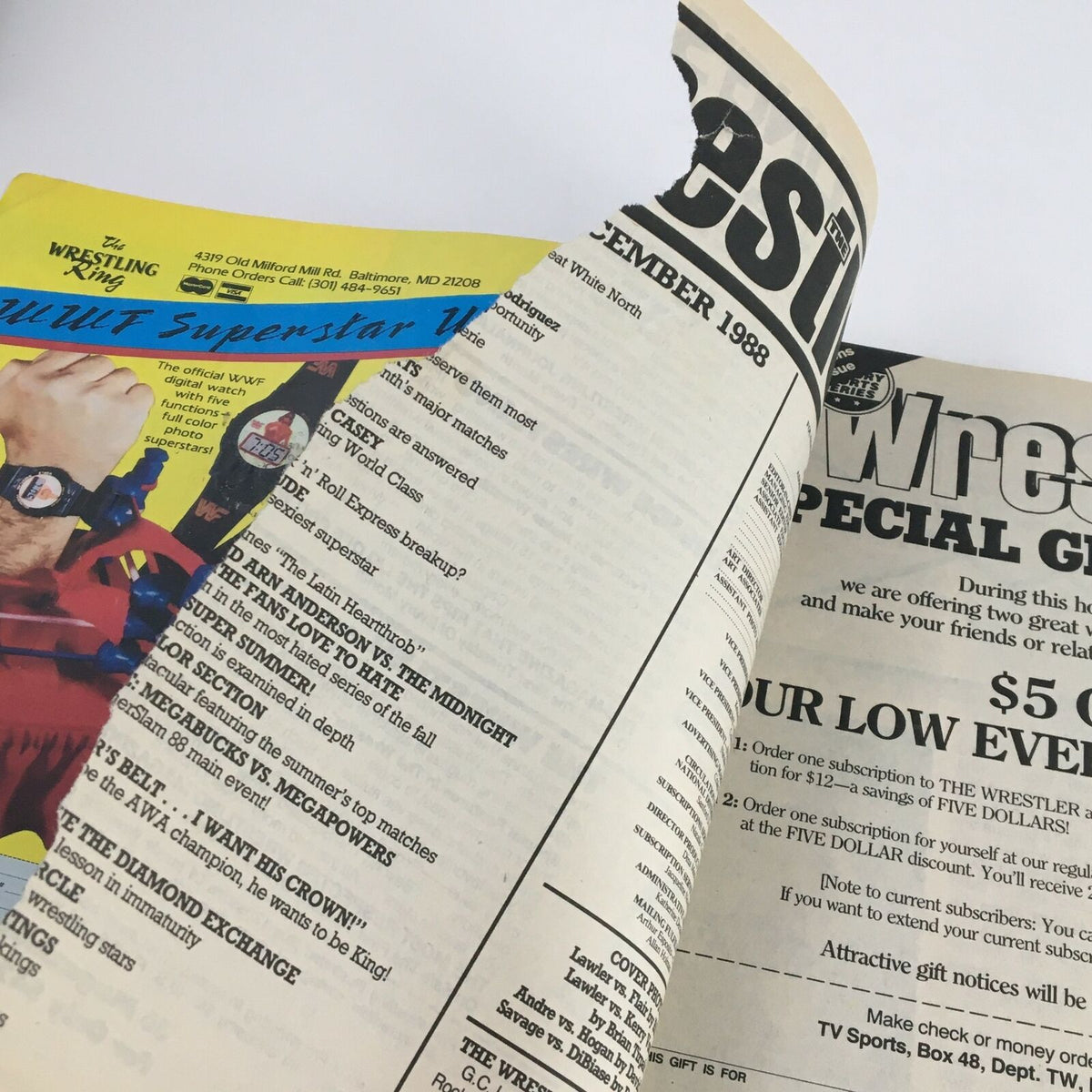 Inside page of The Wrestler, December 1988, displaying the magazine's layout featuring wrestling events and advertisements. Andre The Giant vs Hulk Hogan cover story highlighted.