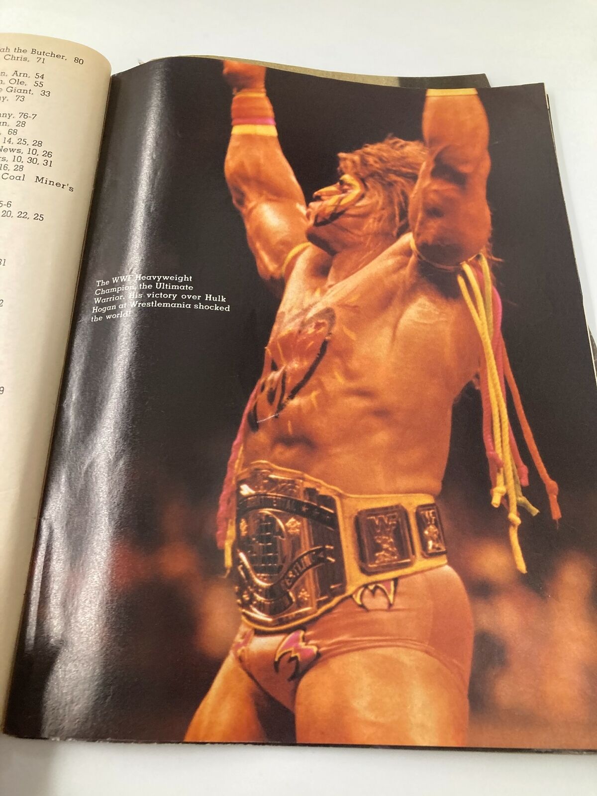 Action photo of the Ultimate Warrior from Wrestling All Stars Scrapbook 1990 #10, capturing a historic moment after defeating Hulk Hogan.