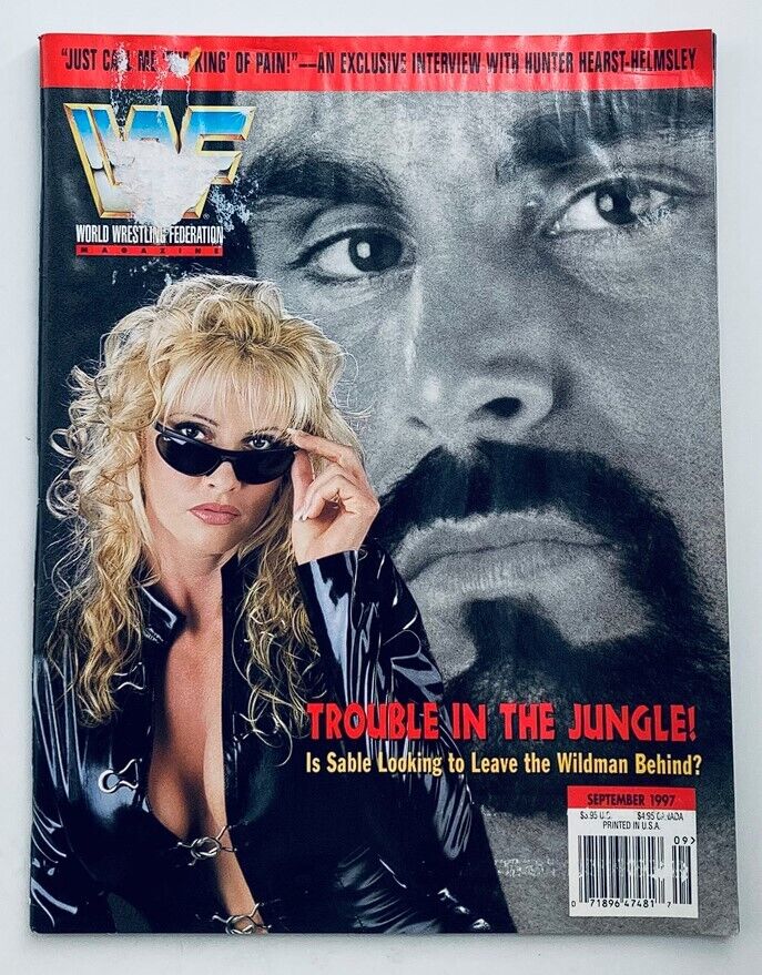 WWF World Wrestling Federation Magazine September 1997 featuring Sable and the Wildman on the cover, highlighting an article about their storyline with the tagline 'Trouble in the Jungle!' and showcasing a dramatic black-and-white image of the Wildman.