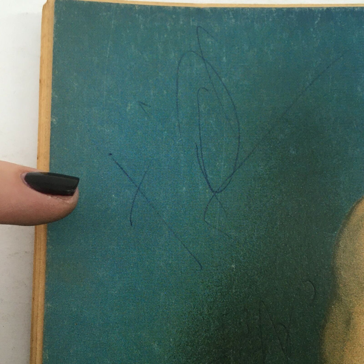 Close-up view of the cover of The Ring's Wrestling Magazine April 1980 Vol 17 #2 highlighting a signature on the cover, where a wrestling star posed for the magazine.