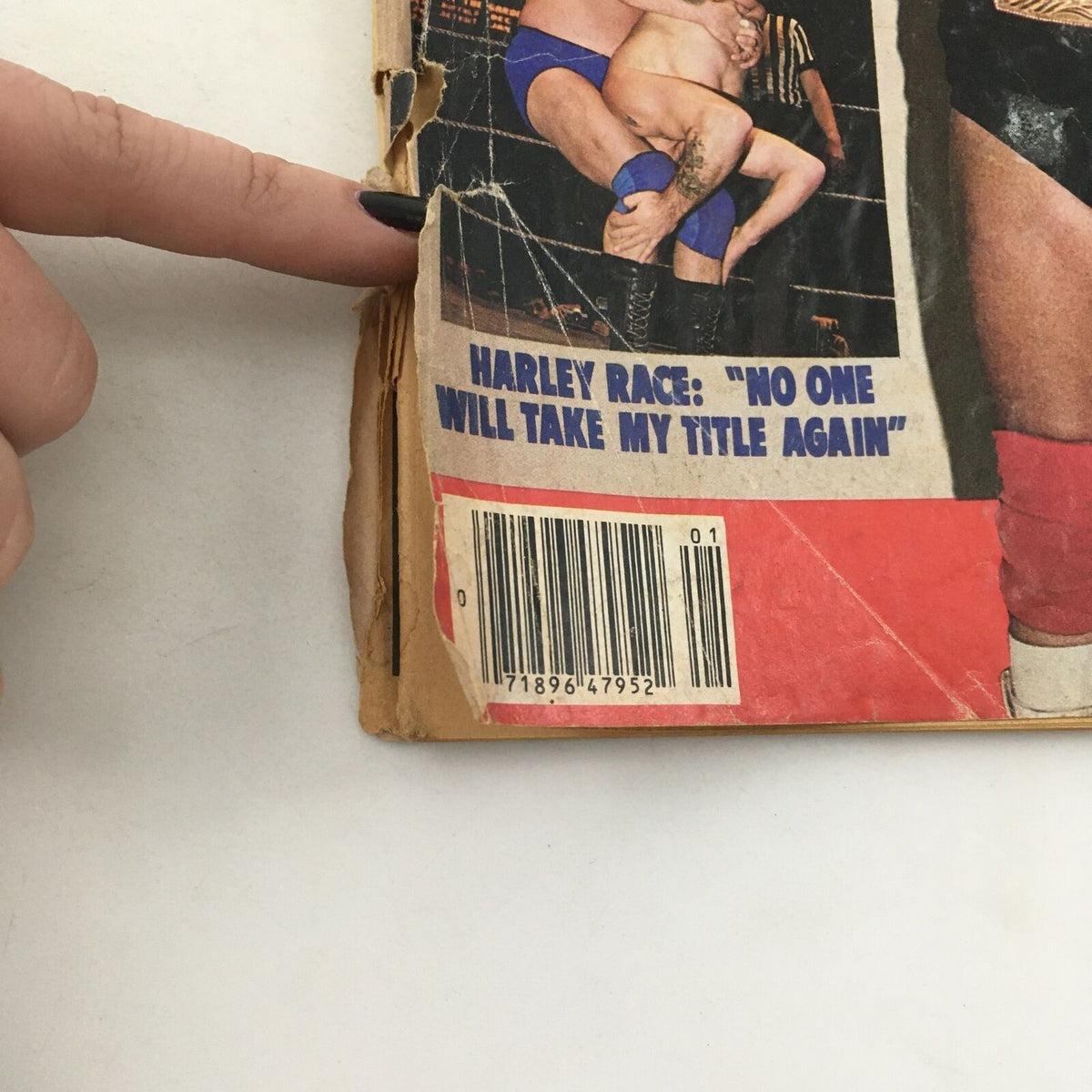 Image of the back cover of WWF Wrestling Magazine Spring 1980 featuring Harley Race with a quote stating, 'NO ONE WILL TAKE MY TITLE AGAIN,' showcasing the magazine's vintage appeal.