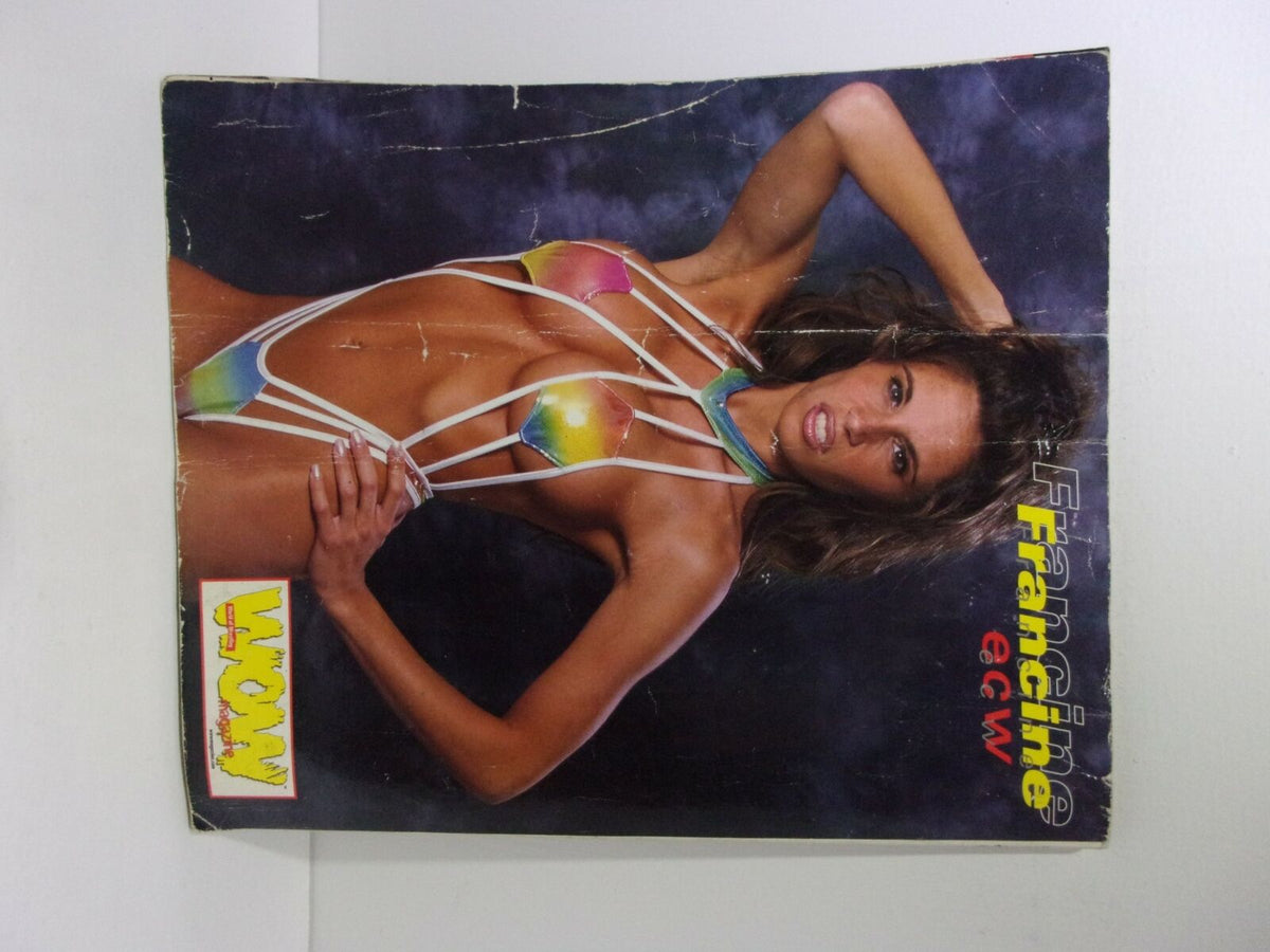 Front cover of World of Wrestling WOW Magazine Sting To Hell and Back featuring a striking image of a female model in an eye-catching outfit, alongside the magazine title.