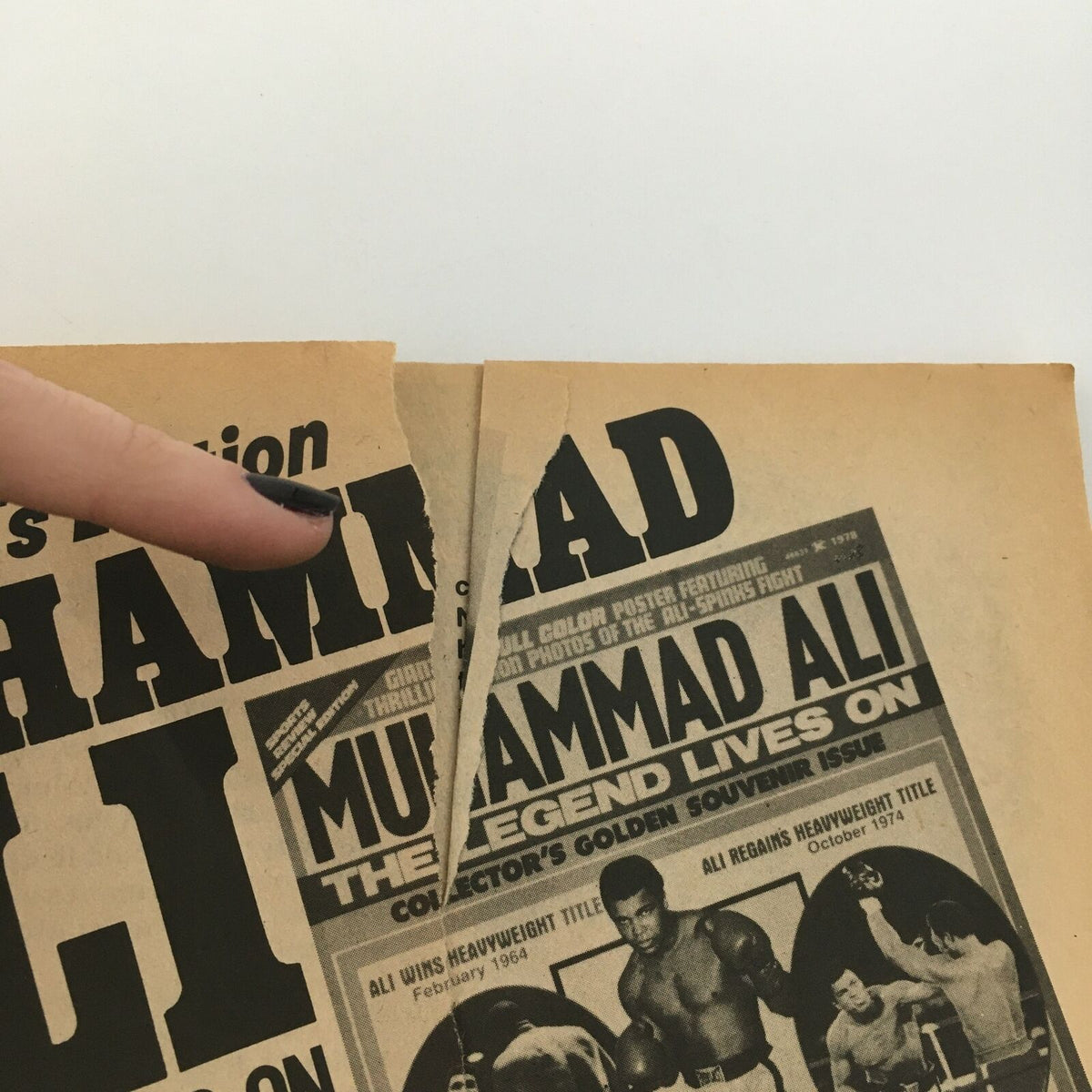 Cover of WWF Wrestling Magazine October 1978 highlighting Muhammad Ali with a torn section, emphasizing its vintage value.