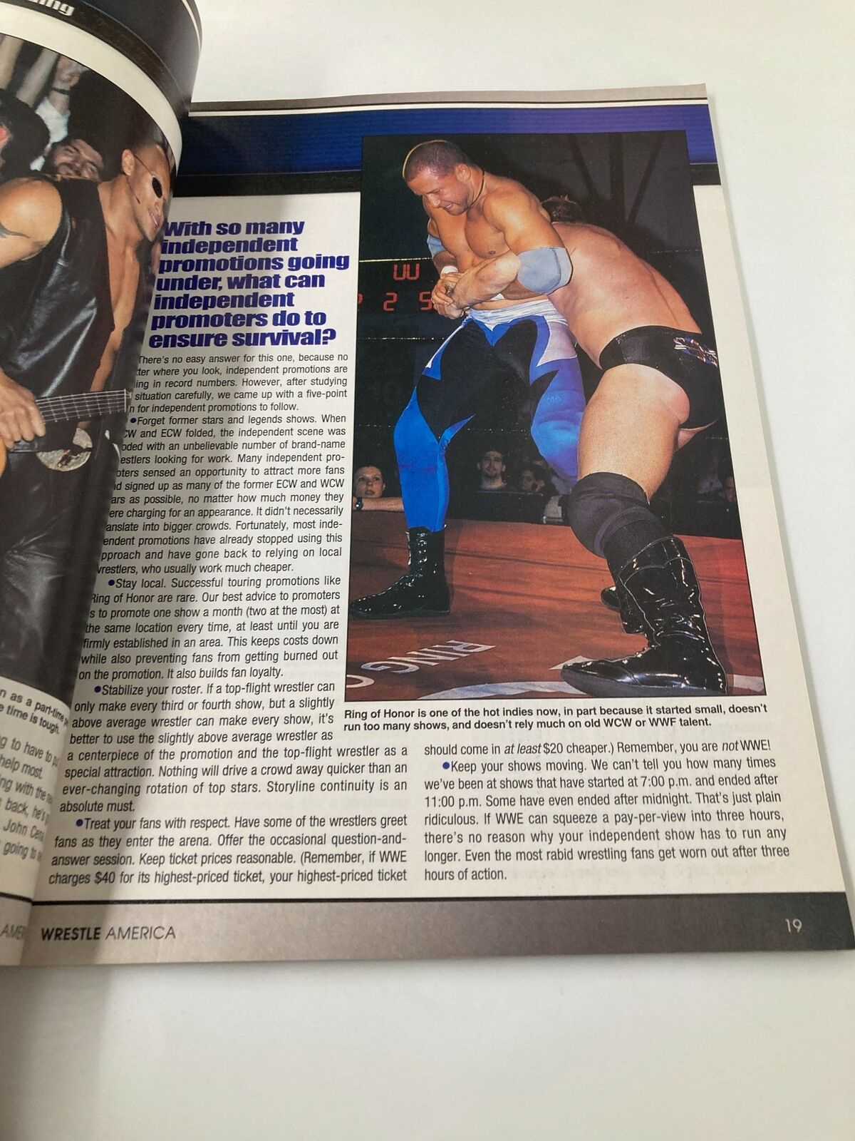 Action shot from Wrestle America Magazine 2003 featuring independent wrestling, highlighting wrestlers in a bout.