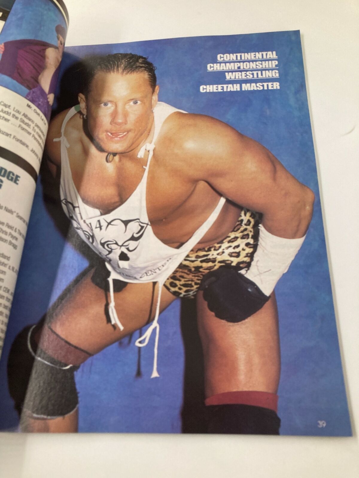 Cheetah Master posing in his wrestling attire, showcased in the Wrestle America Magazine 2003.