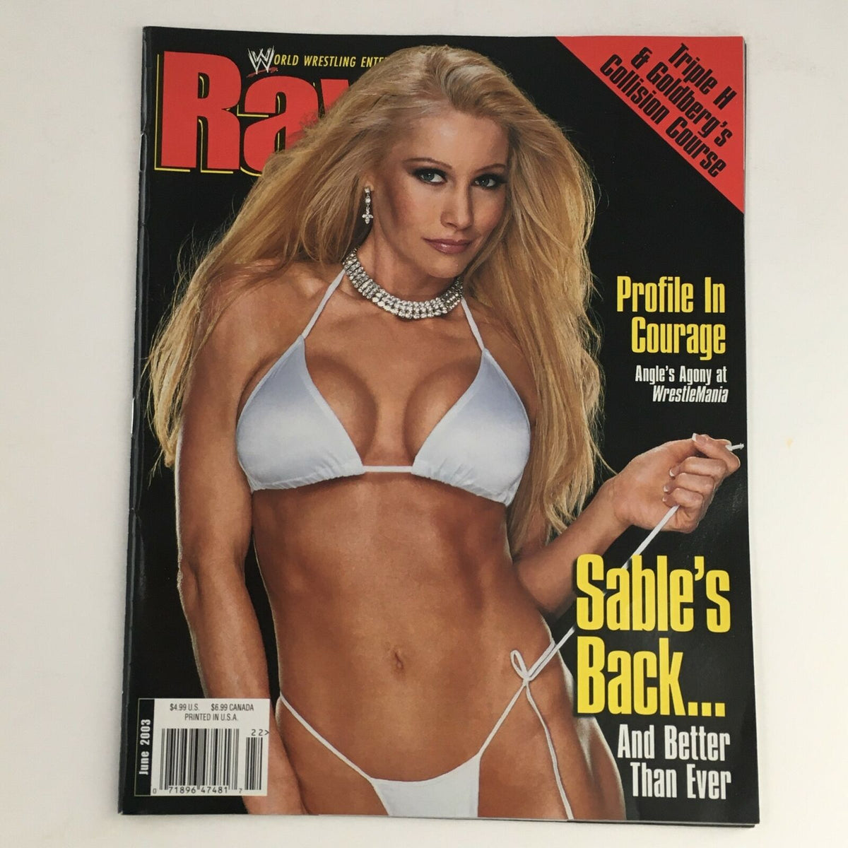 WWE Raw Magazine June 2003 featuring Sable on the cover, showcasing her in a white bikini, highlighting her iconic presence in professional wrestling.