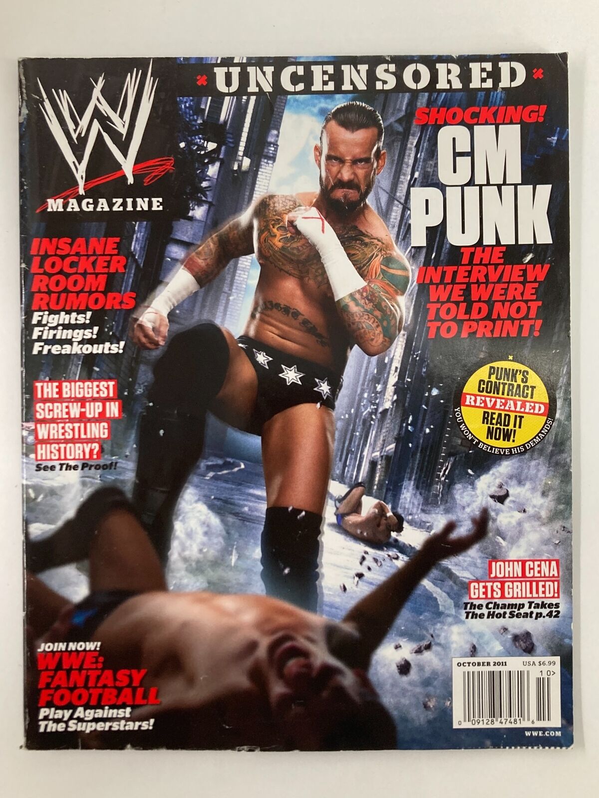 WWE Magazine October 2011 cover featuring CM Punk in an intense wrestling pose; highlights include shocking interview details and fantasy football insights.