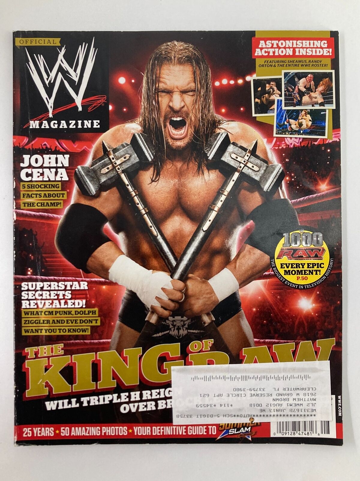 WWE Magazine August 2012 cover featuring Triple H with a fierce expression holding two sledgehammers, along with John Cena's name and a mention of astonishing action inside. A must-have collectible for wrestling fans.