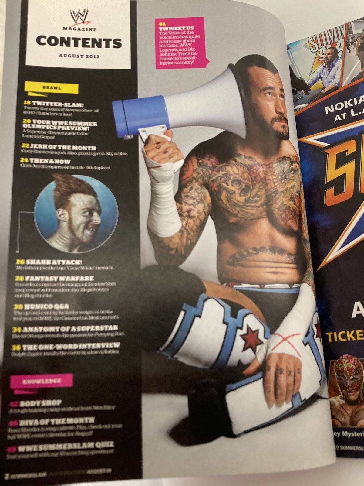 Interior page of WWE Magazine August 2012 showing the table of contents including features on CM Punk, Dolph Ziggler, and other wrestling highlights. This vintage magazine is essential for collectors.
