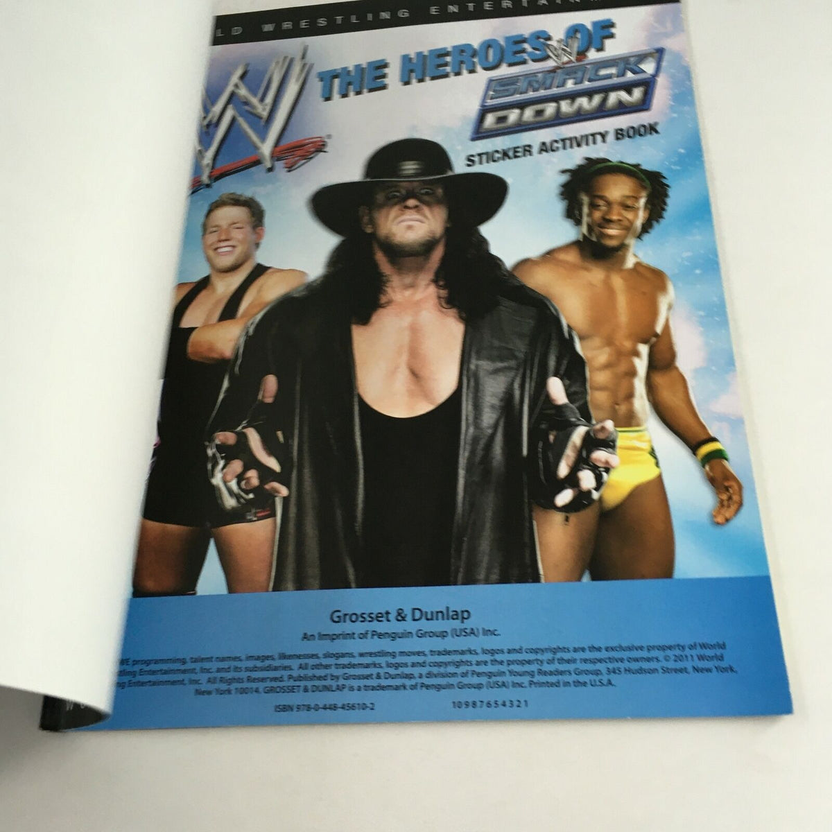 Cover of WWE Sticker Activity Book 'The Heroes of Smack Down' featuring The Undertaker, Rey Mysterio, and other wrestling stars.