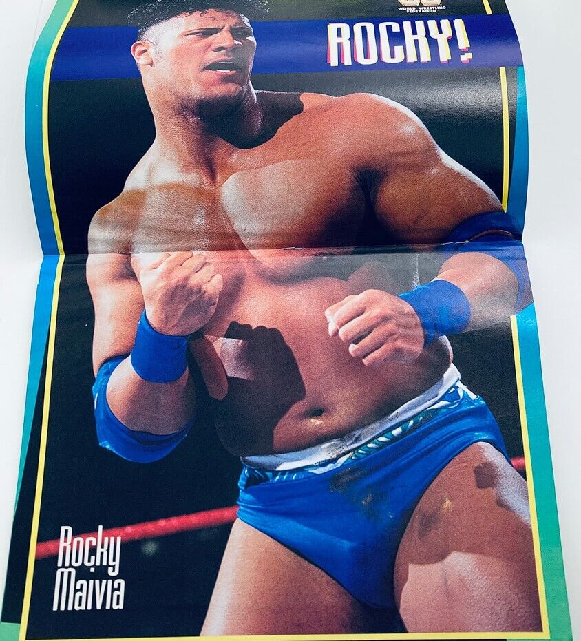 WWF World Wrestling Federation Magazine March 1997 featuring Ahmed Johnson with a vibrant poster of Rocky Maivia, showcasing a dynamic wrestling moment.