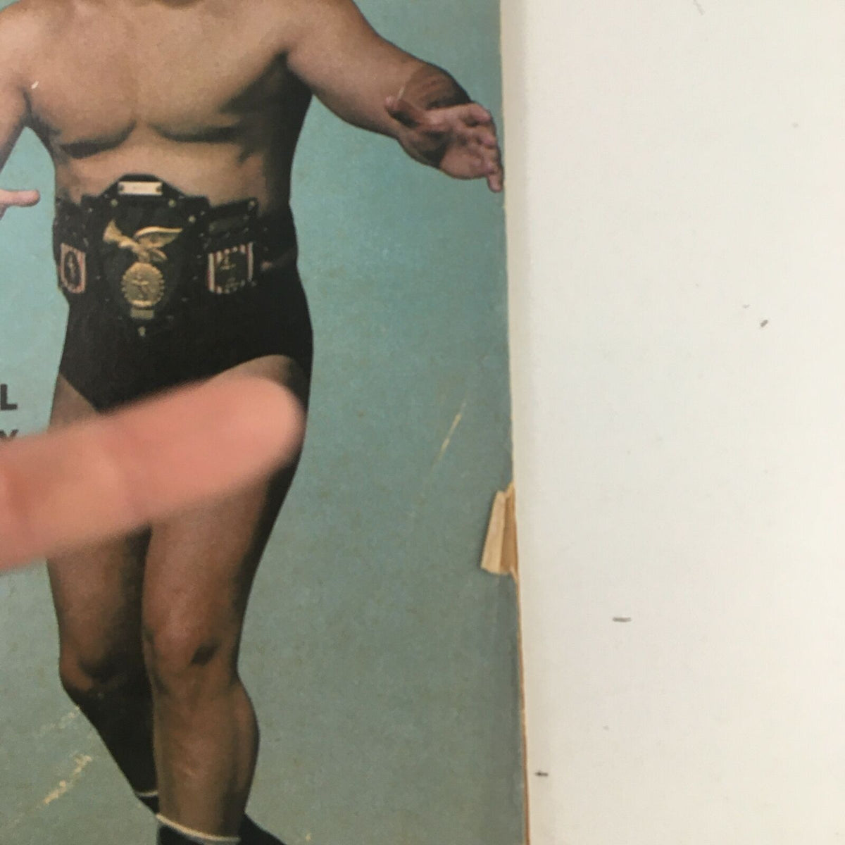 Close-up view of Pedro Morales featured on the cover of Wrestling Revue Magazine May 1973, highlighting his championship belt and wrestling pose.