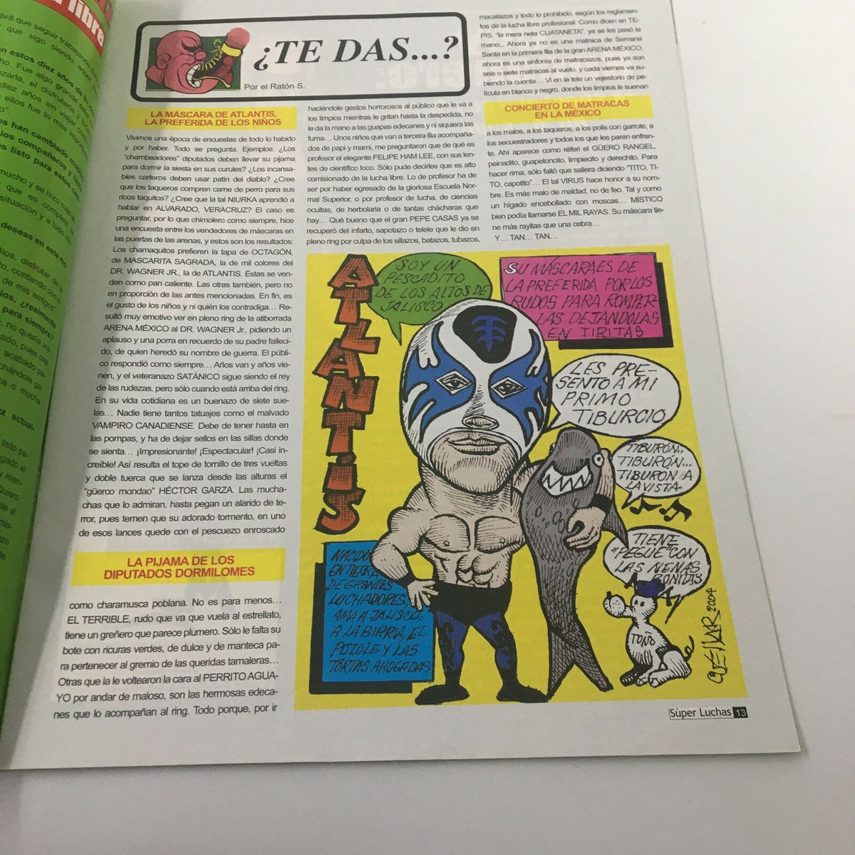 Illustrative segment featuring the wrestler Atlantis in Super Luchas Magazine October 2004. The colorful cartoon highlights wrestling culture, complementing the story of Guerrera Campeon in X-Law.