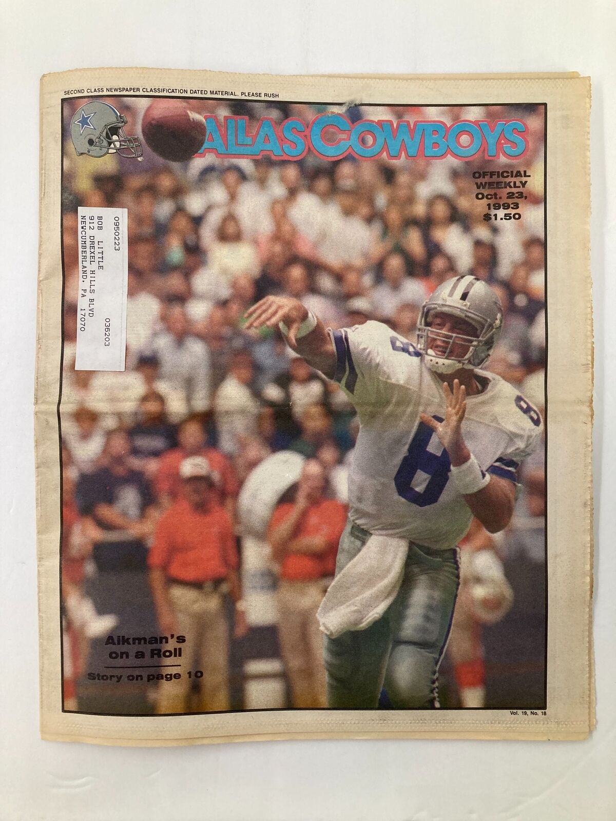Dallas Cowboys Weekly Newspaper from October 23, 1993, Vol 19 #18 featuring Troy Aikman passing the football. Cover highlights Aikman on a roll with a story on page 10.