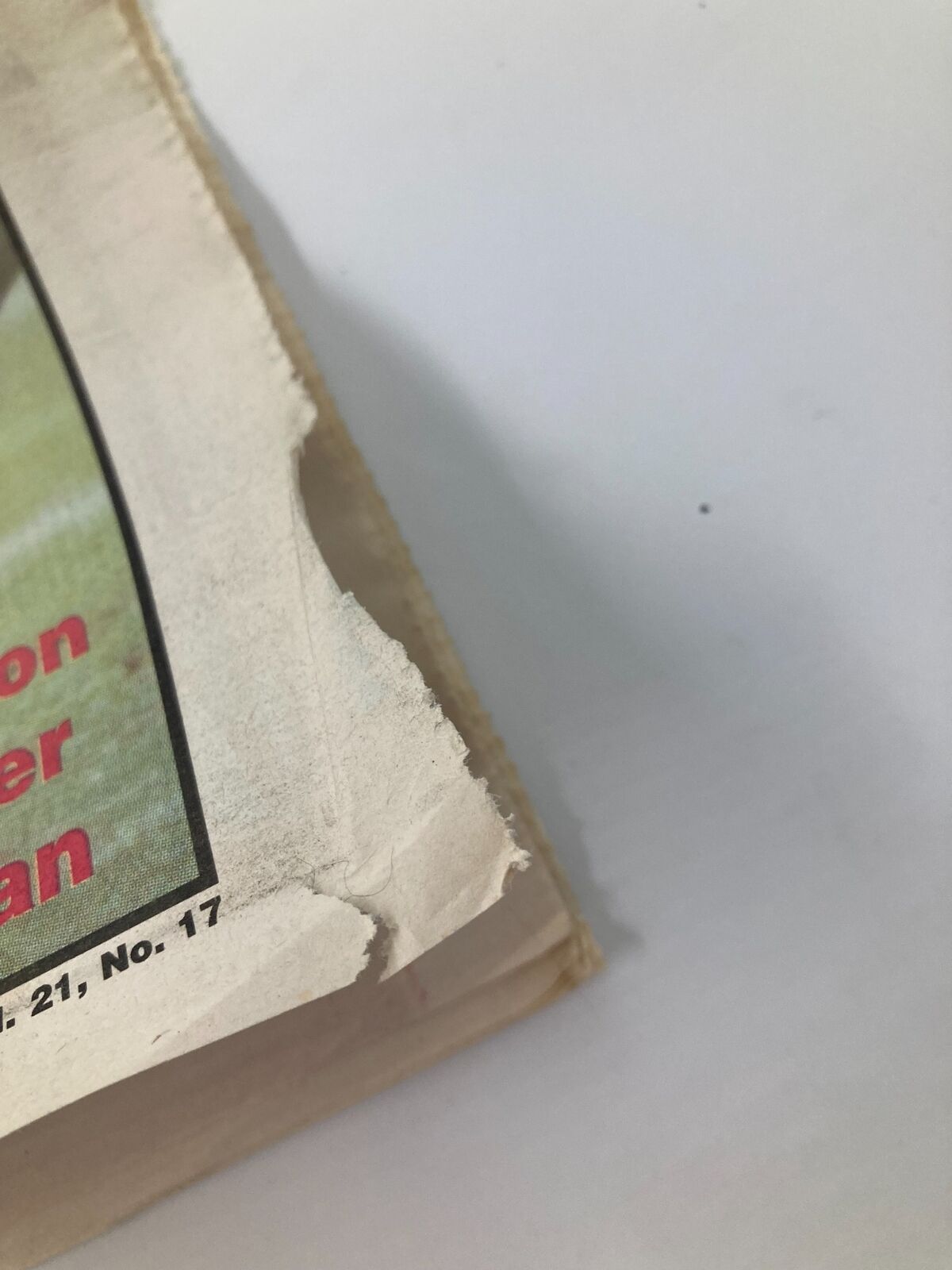 Side view of the Dallas Cowboys Weekly Newspaper illustrating wear and tear, with frayed edges and the title visible, dated October 7, 1995.