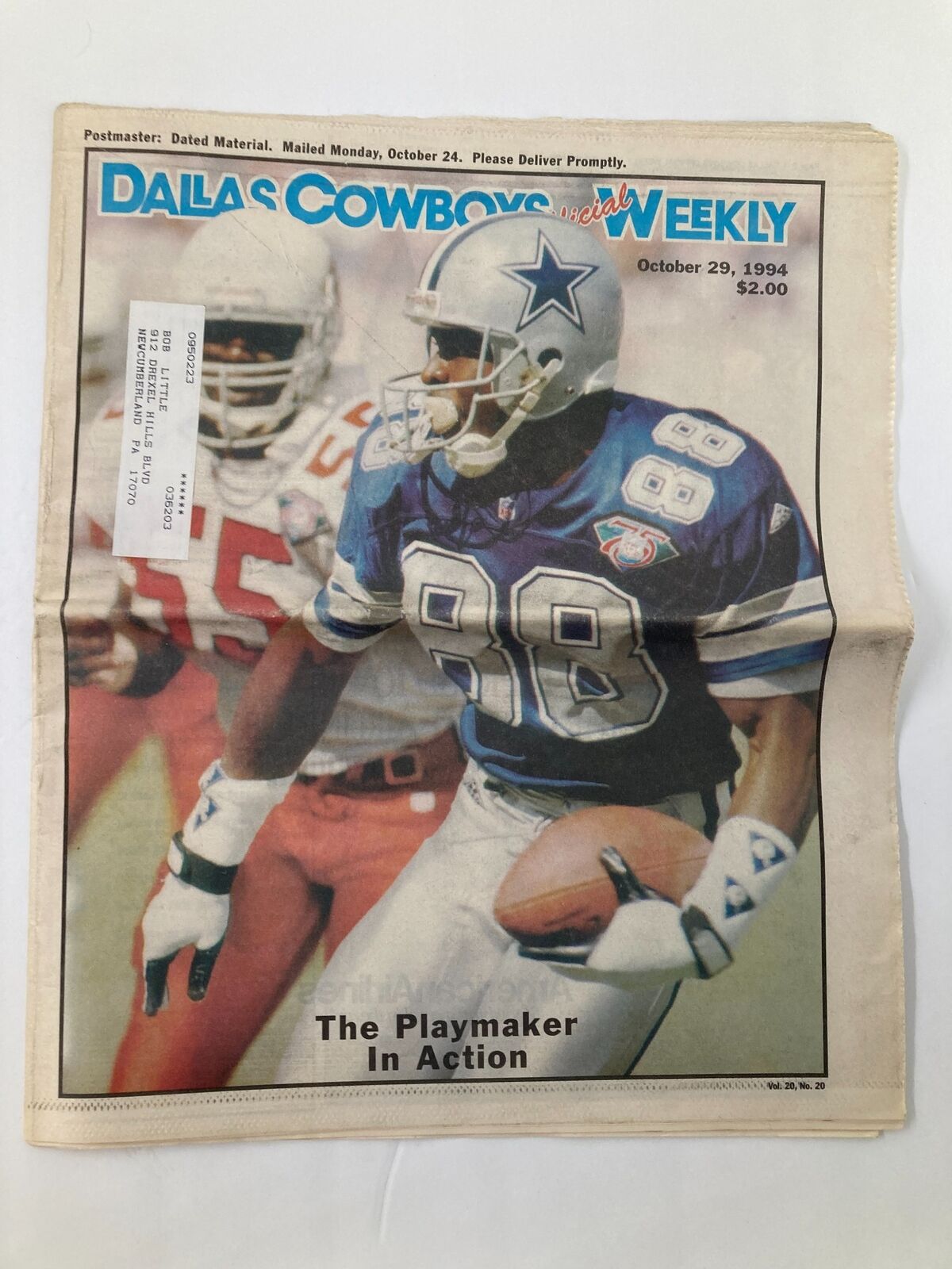 Dallas Cowboys Weekly Newspaper October 29 1994 Vol 20 #20 featuring Michael Irvin on the cover, showcasing the player in action wearing a blue jersey, capturing a dynamic moment of the game.