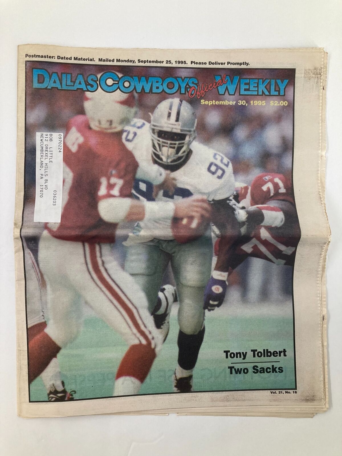 Dallas Cowboys Weekly Newspaper September 30 1995 Vol 21 #16 featuring Tony Tolbert on the cover, depicting him in action during a football game.
