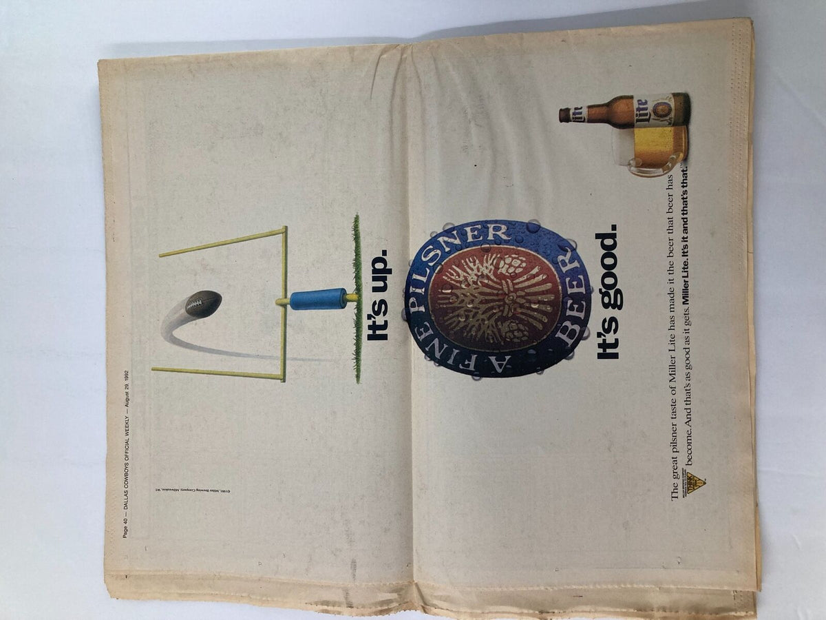 Inside page of the Dallas Cowboys Weekly Newspaper August 29 1992 Vol 18 #11 featuring an advertisement with a football goalpost and a beer bottle, highlighting the text 'It's up. It's good.'