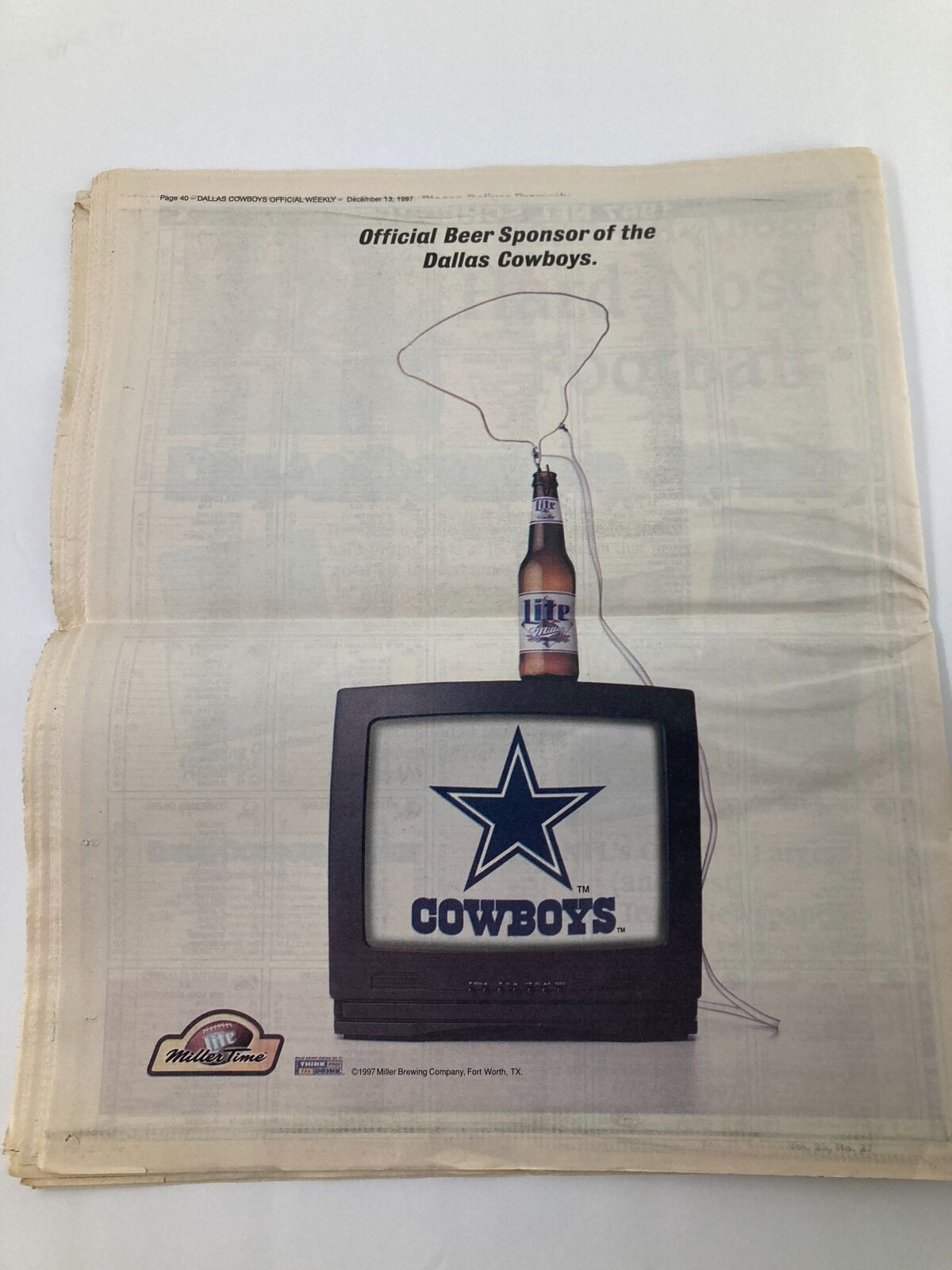 Advertisement from the Dallas Cowboys Weekly Newspaper December 13 1997 Vol 23 #27 promoting an official beer sponsor with the Cowboys logo on a television.