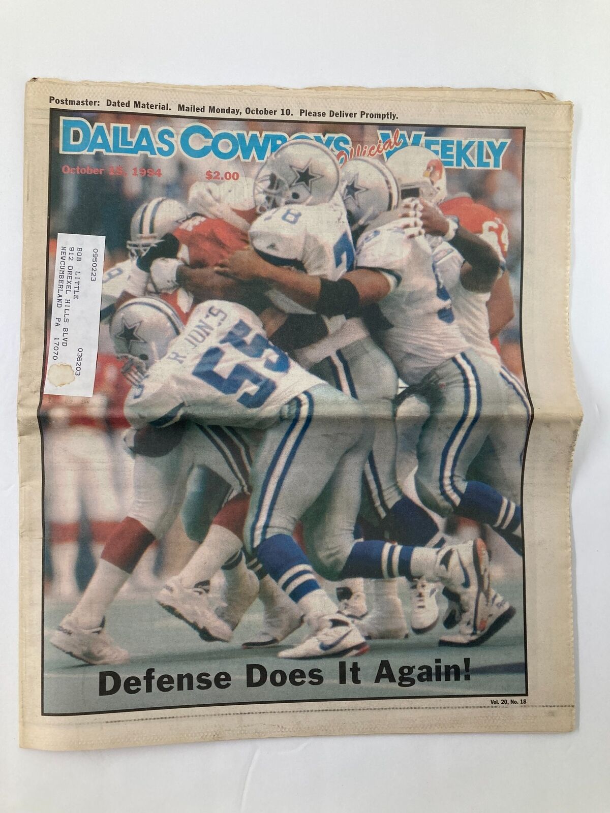 Dallas Cowboys Weekly Newspaper October 15 1994 Vol 20 #18 featuring a powerful defense on the cover, capturing the excitement of the game with football players in action.