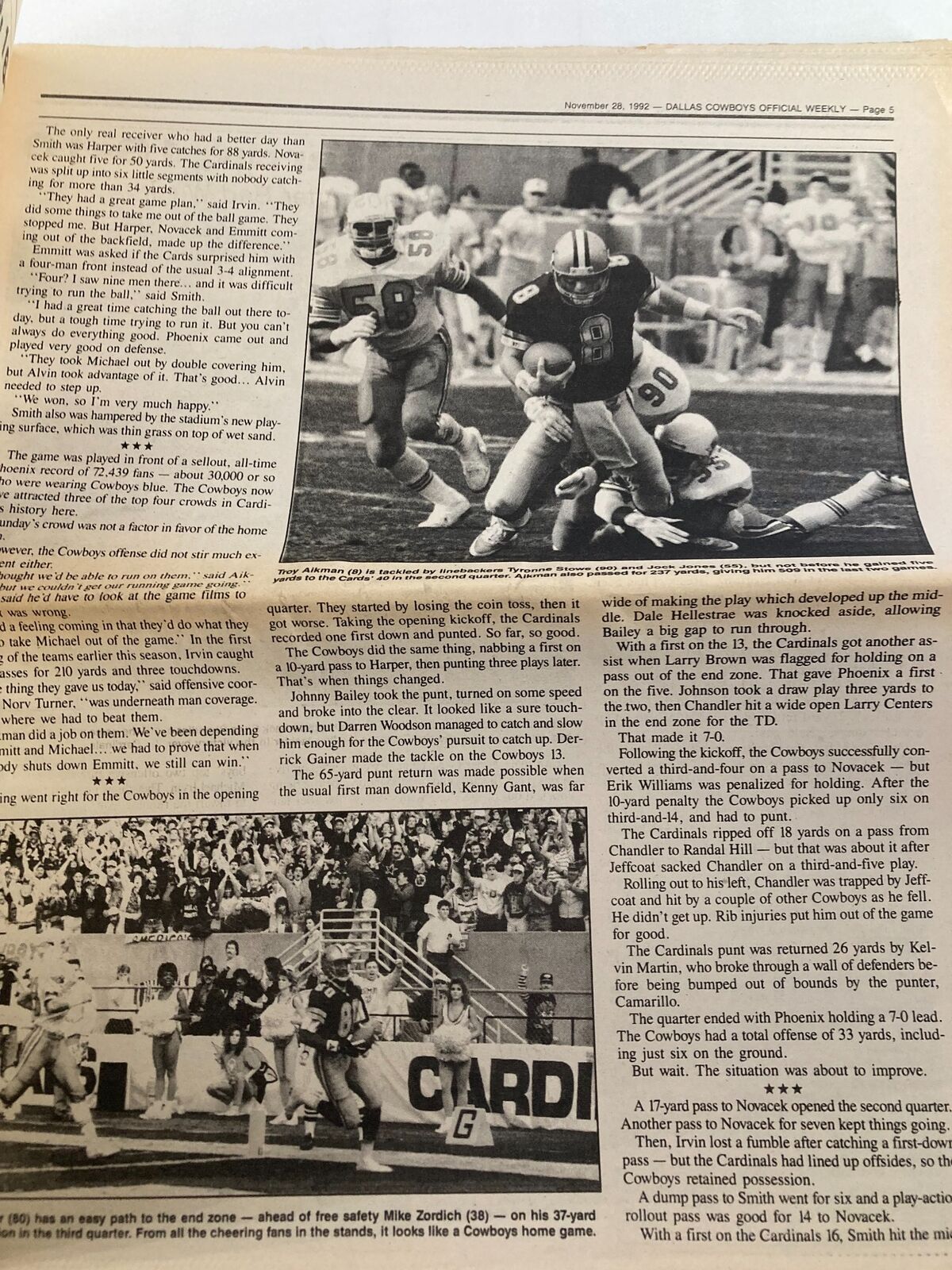 Image from Dallas Cowboys Weekly Newspaper November 28 1992 Vol 18 #24 featuring a Cowboys player evading defenders from the Arizona Cardinals during an intense gameplay moment.