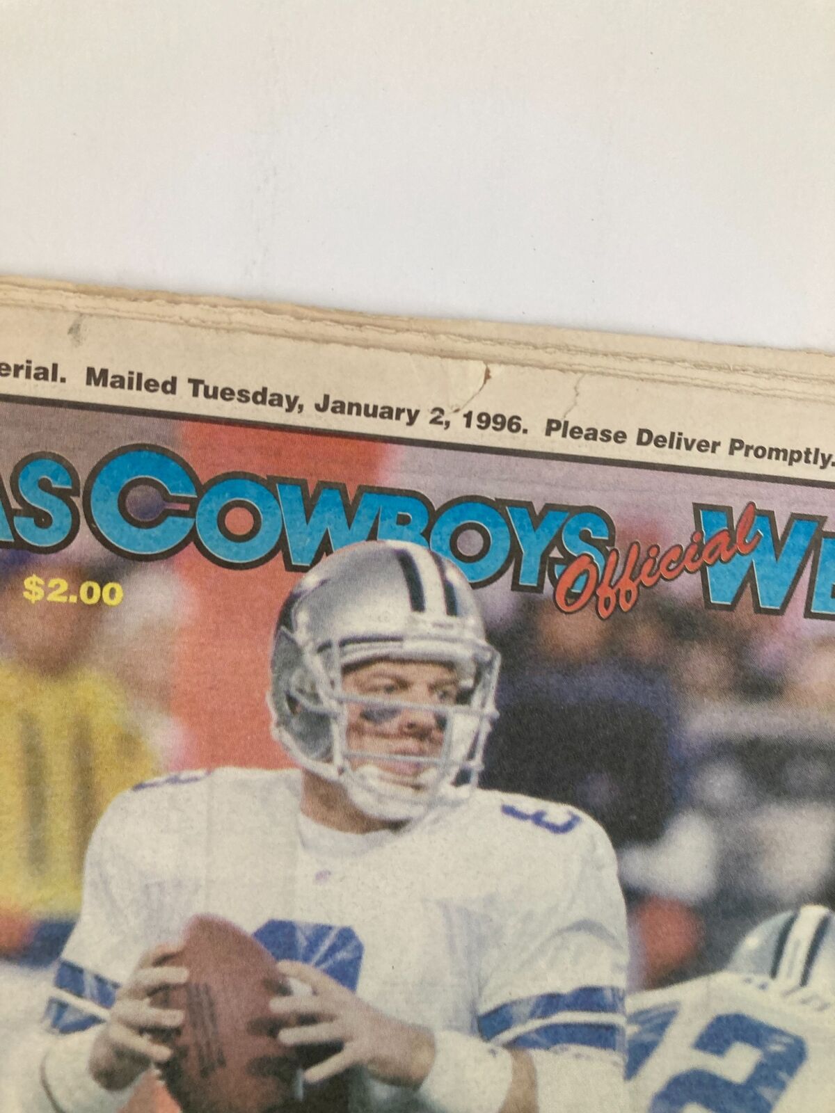 Another close-up of the Dallas Cowboys Weekly Newspaper January 6 1996 Vol 21 #30, focusing on Troy Aikman with the price tag visible.