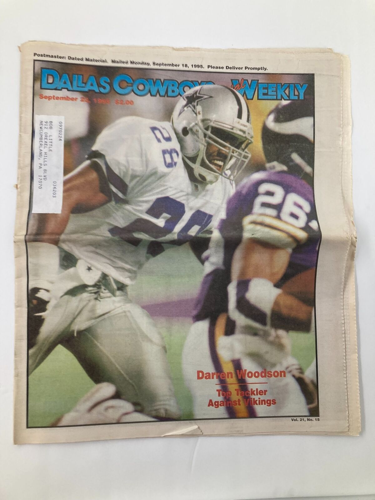 Dallas Cowboys Weekly Newspaper September 23 1995 featuring Darren Woodson, showcasing him in action during a game against the Vikings. The cover highlights his role as the top tackler.