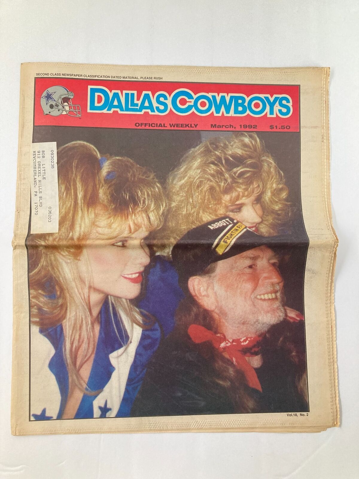 Cover of the Dallas Cowboys Weekly Newspaper from March 1992, featuring two women alongside a man wearing a cowboy hat, with the title 'Dallas Cowboys Weekly Newspaper March 1992 Vol 18 #2 Looking for Cornerbacks'.