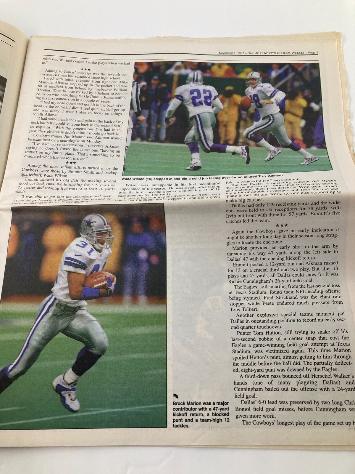 Inside page of the Dallas Cowboys Weekly Newspaper November 1 1997 Vol 23 #21 showcasing Brock Marion with the ball during a play.