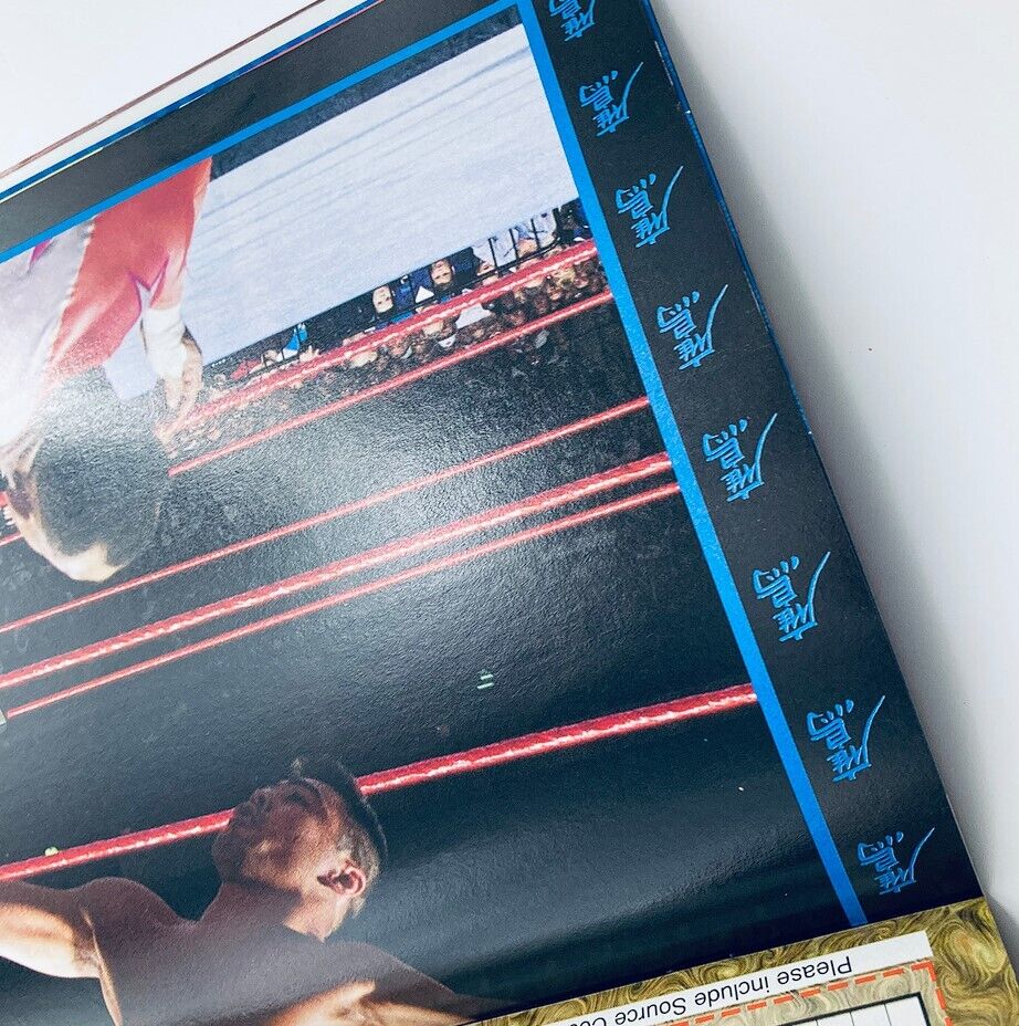 WWF World Wrestling Federation Magazine May 1998 The Undertaker Edition showcasing an intense wrestling match, featuring a close-up of two wrestlers in the ring with the audience cheering in the background.
