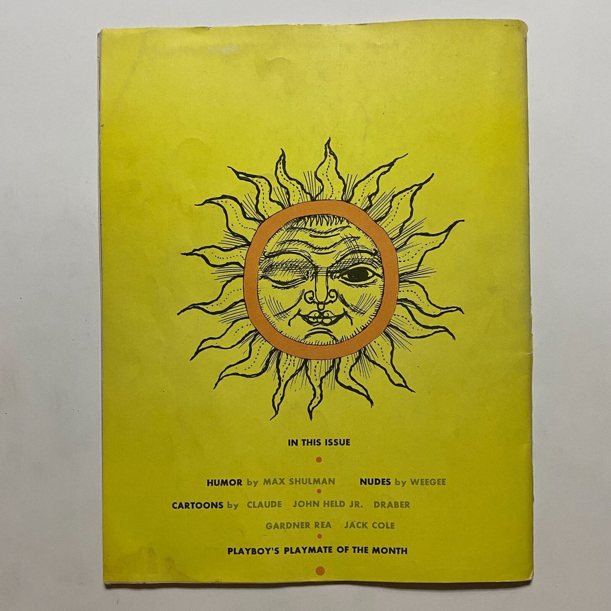 Cover of VTG Playboy Magazine May 1954 featuring a vibrant yellow design with a sun illustration and text listing featured content including humor and nudes, highlighting Joanne Arnold as Playmate of the Month.
