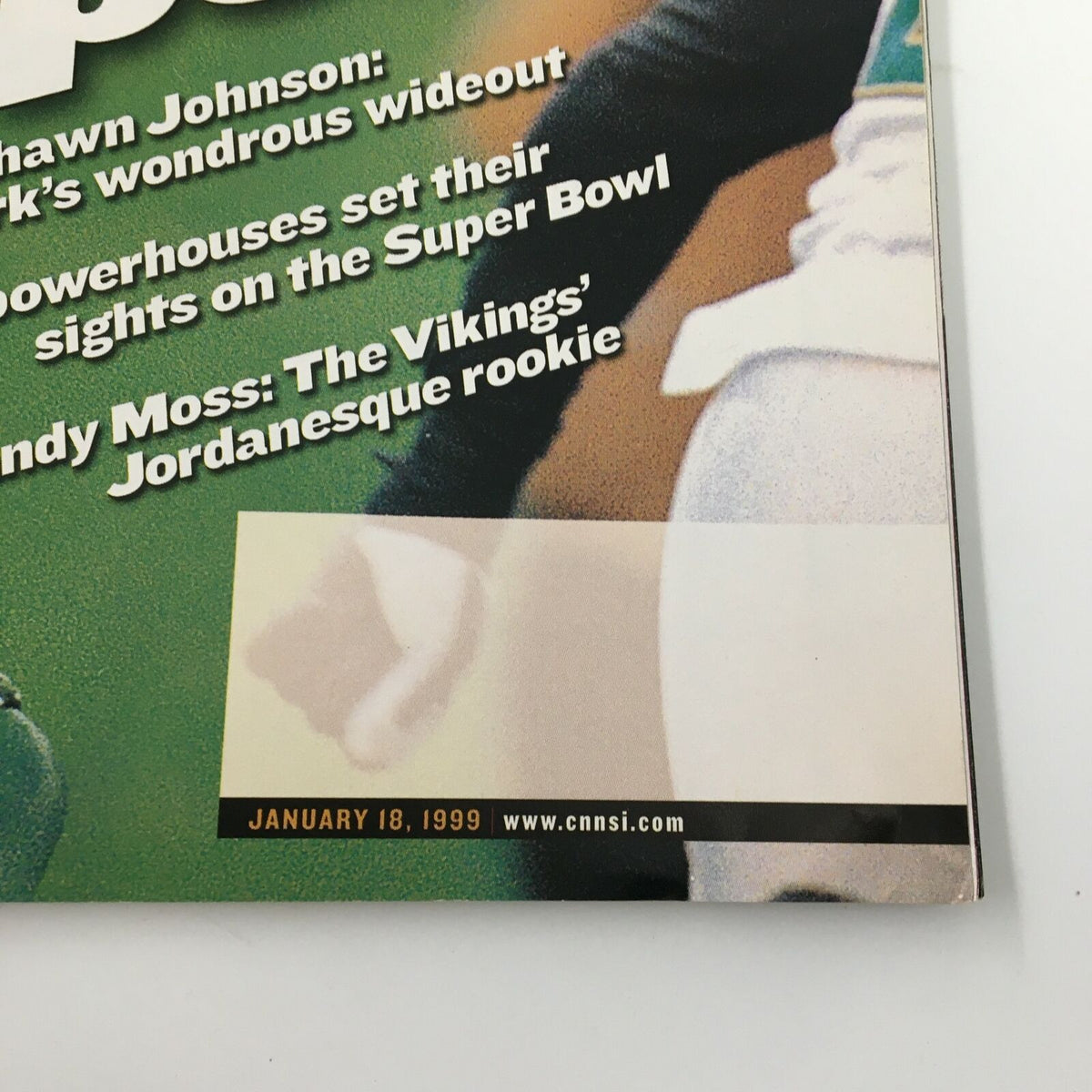 Close-up view of Sports Illustrated Magazine January 18, 1999 details, displaying Keyshawn Johnson's feature and headlines related to NFL players and the upcoming Super Bowl.