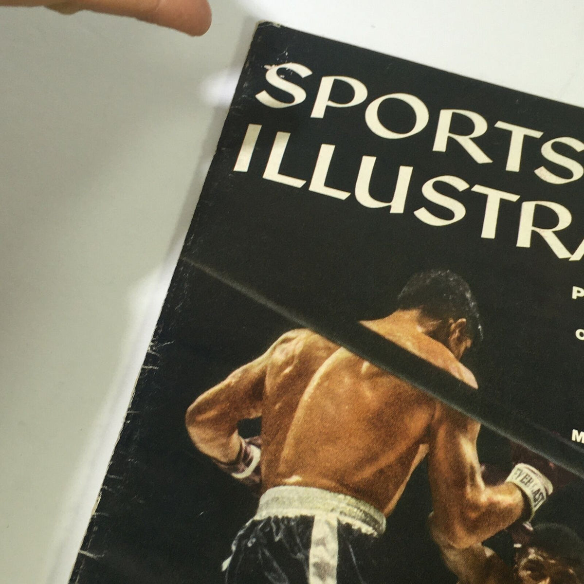 Oblique view of the September 1, 1958 Sports Illustrated Magazine, emphasizing the boxing action between Floyd Patterson and Roy Harris on the cover.