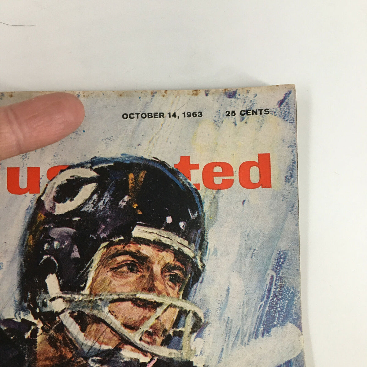 Close-up view of the cover of the Vintage Sports Illustrated magazine October 14, 1963 featuring Ronnie Bull, highlighting the date and price.