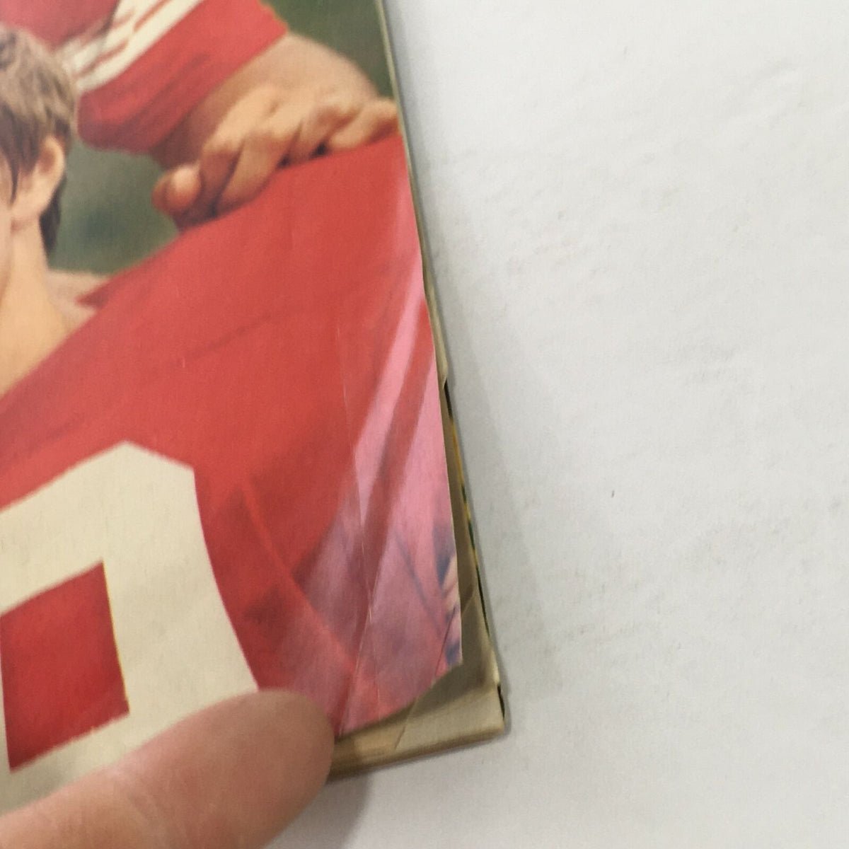 Close-up detail of the side of the Sports Illustrated magazine from October 30, 1972, showing minor wear and tear on the edges, indicating age while preserving its collectible value.