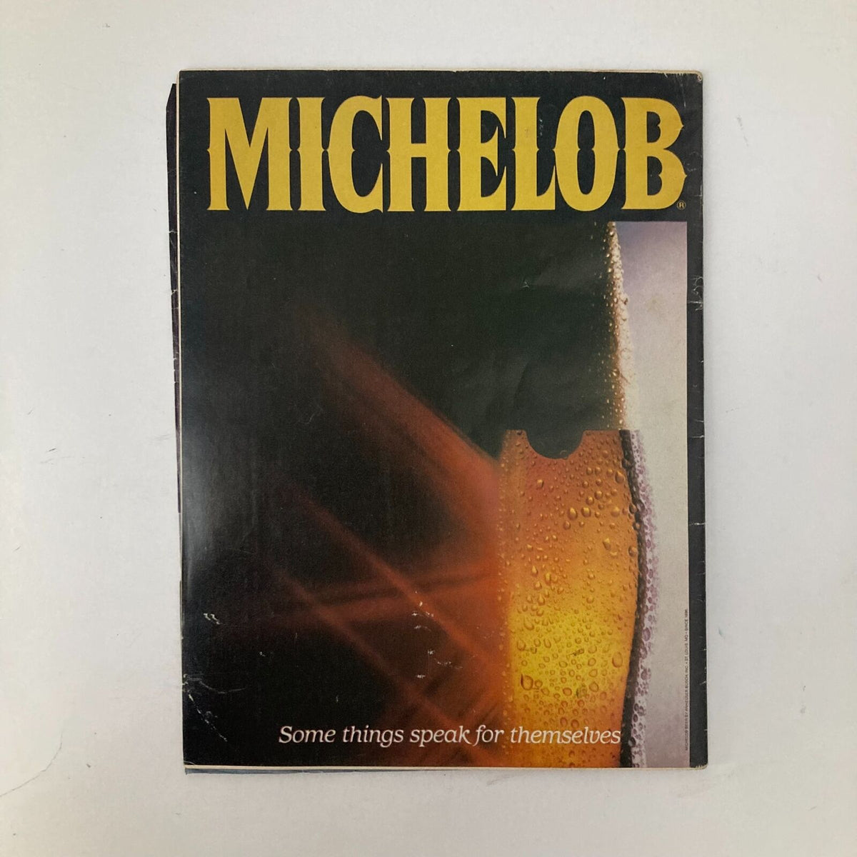 Cover of Michelob advertisement magazine with catchy tagline 'Some things speak for themselves'.