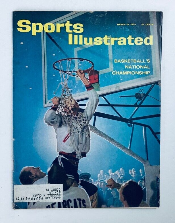 Cover of VTG Sports Illustrated Magazine March 18 1963 Vol 18 No. 11 featuring a basketball player celebrating and cutting down the net after winning a game.