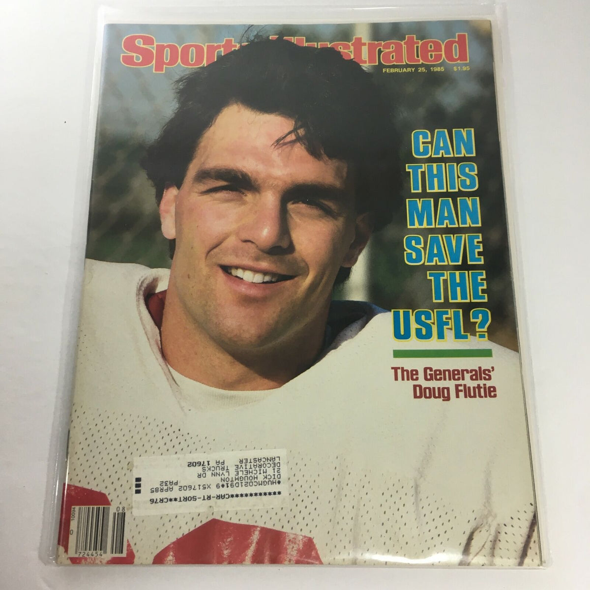 Sports Illustrated magazine cover from February 25, 1985 featuring Doug Flutie with the headline 'Can This Man Save The USFL?'. The image showcases Flutie's confident smile as he represents the USFL.