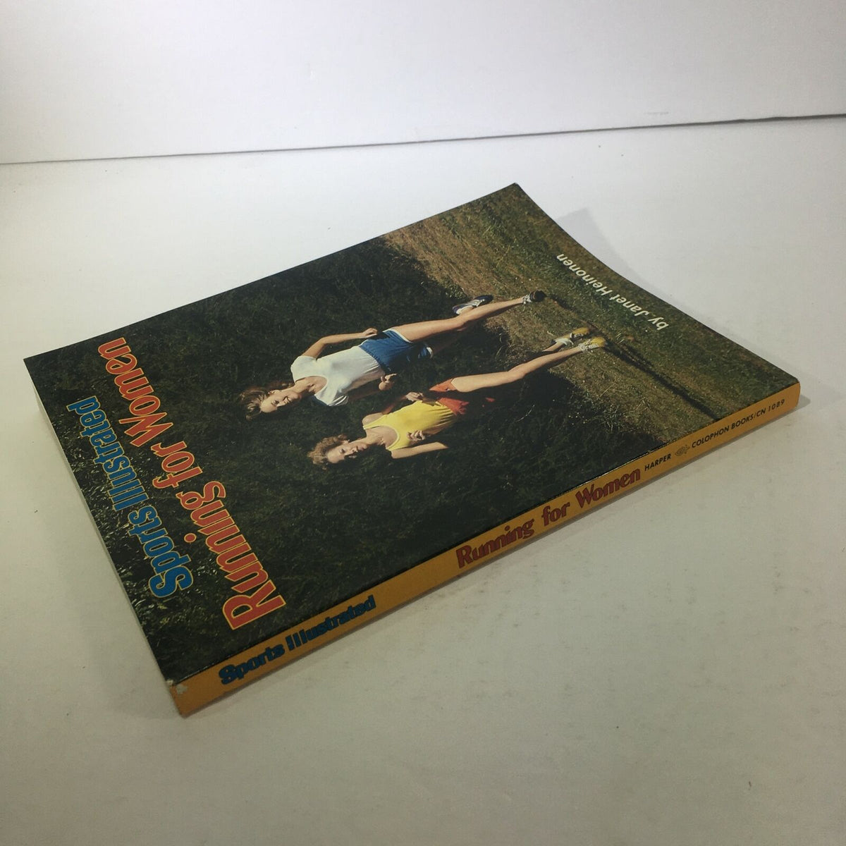 Side view of Vintage Sports Illustrated Magazine: 1979 - Running For Women, showcasing the magazine's thickness and spine.