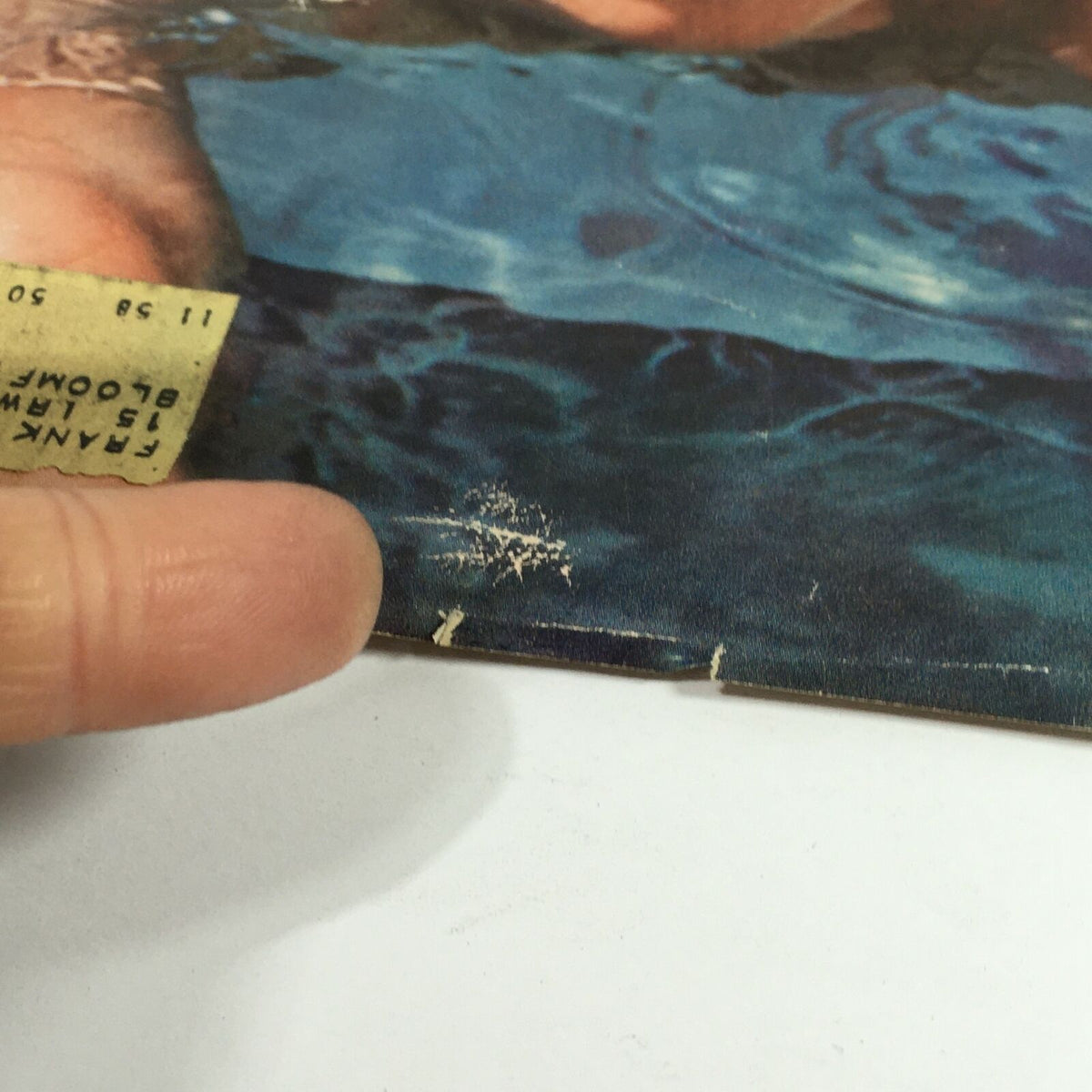 Detail view of the corner of VTG Sports Illustrated Magazine July 21, 1958, highlighting a small address label and wear, adding character to this collectible.
